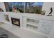 Close-up of stone fireplace with built-in shelving at 32472 N 68Th Pl, Scottsdale, AZ 85266