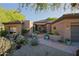 Inviting front entrance with desert landscaping, stone pathway, and neutral exterior paint at 32472 N 68Th Pl, Scottsdale, AZ 85266