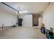 Spacious garage with epoxy floor, storage cabinets, and garage door opener at 32472 N 68Th Pl, Scottsdale, AZ 85266