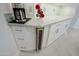 A sleek, modern kitchen features a built-in wine cooler and granite countertops at 32472 N 68Th Pl, Scottsdale, AZ 85266