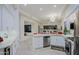 Open kitchen with granite countertop island, modern appliances, and an adjacent dining area at 32472 N 68Th Pl, Scottsdale, AZ 85266