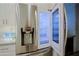 Close up showcasing stainless steel refrigerator with ice maker and bright interior lighting at 32472 N 68Th Pl, Scottsdale, AZ 85266