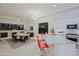 Bright kitchen with granite countertop, red bar stools, and stainless steel appliances at 32472 N 68Th Pl, Scottsdale, AZ 85266