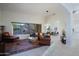 Spacious living room with tile floors, large windows, and an open floor plan at 32472 N 68Th Pl, Scottsdale, AZ 85266