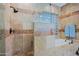 Bathroom showcases a walk-in shower, decorative tile, and glass block window at 32472 N 68Th Pl, Scottsdale, AZ 85266