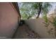 Narrow side yard with gravel bed and decorative rocks, along with lush desert landscaping at 32472 N 68Th Pl, Scottsdale, AZ 85266