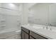 Bathroom showcasing double sinks, a shower-tub combination, and elegant fixtures at 35524 N Tin Ct, San Tan Valley, AZ 85144