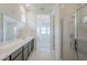 Modern bathroom featuring a vanity with double sinks and a tiled shower at 35524 N Tin Ct, San Tan Valley, AZ 85144