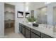 Stylish bathroom features a double vanity with ample counter space and a separate shower area at 35524 N Tin Ct, San Tan Valley, AZ 85144