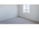 Bright bedroom with neutral carpet, natural light, and clean, white walls create a calming and inviting space at 35524 N Tin Ct, San Tan Valley, AZ 85144