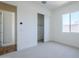 Bright bedroom featuring neutral carpet, closet, and natural light creates a welcoming and functional space at 35524 N Tin Ct, San Tan Valley, AZ 85144