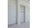 White closet with sliding doors and neutral carpet creates an organized and functional space in the home at 35524 N Tin Ct, San Tan Valley, AZ 85144