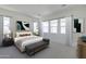 Serene main bedroom with natural light, plush bedding, and stylish decor at 35524 N Tin Ct, San Tan Valley, AZ 85144