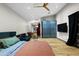 Bright bedroom featuring a queen bed, sofa, and wooden floors at 358 E Whitton Ave, Phoenix, AZ 85012