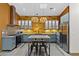 Modern kitchen with gray cabinets, concrete countertops, a yellow backsplash, and stainless steel appliances at 358 E Whitton Ave, Phoenix, AZ 85012