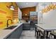 Bright kitchen with gray cabinets, stainless steel appliances, stylish lighting, and an eat-in counter at 358 E Whitton Ave, Phoenix, AZ 85012