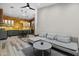 Open concept with modern kitchen and a living room with a gray sectional and wood floors at 358 E Whitton Ave, Phoenix, AZ 85012