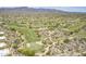 Scenic aerial view features a well-manicured golf course and lush desert landscape with mountain views at 36601 N Mule Train Rd # D1, Carefree, AZ 85377