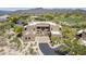 Stunning aerial view showcases the property's beautiful desert surroundings, golf course access, and mountain views at 36601 N Mule Train Rd # D1, Carefree, AZ 85377