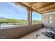 Covered outdoor balcony with railings and desert views at 36601 N Mule Train Rd # D1, Carefree, AZ 85377