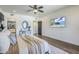 Bright bedroom with a ceiling fan and access to the bathroom at 36601 N Mule Train Rd # D1, Carefree, AZ 85377