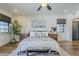 Spacious bedroom with textured wall, ceiling fan and a window with natural light at 36601 N Mule Train Rd # D1, Carefree, AZ 85377