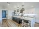 Bright kitchen features a large island with bar seating, modern appliances, and stylish pendant lighting at 36601 N Mule Train Rd # D1, Carefree, AZ 85377