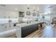 Bright kitchen features a large island with bar seating, modern appliances, and stylish pendant lighting at 36601 N Mule Train Rd # D1, Carefree, AZ 85377