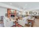 Bright living room features a fireplace, beamed mantel, and comfortable seating at 36601 N Mule Train Rd # D1, Carefree, AZ 85377