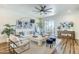 Bright living room with white sofa, chairs, area rug, stylish decor, and an outdoor view at 36601 N Mule Train Rd # D1, Carefree, AZ 85377