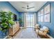 Cozy living room features bright blue walls, patio access, and comfortable seating at 36601 N Mule Train Rd # D1, Carefree, AZ 85377