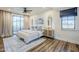 Cozy main bedroom featuring a comfortable bed, soft lighting, and a private balcony at 36601 N Mule Train Rd # D1, Carefree, AZ 85377