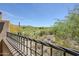 Scenic view of the desert landscape, showcasing the lush green golf course and mountainous terrain at 36601 N Mule Train Rd # D1, Carefree, AZ 85377