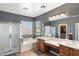 Large main bathroom featuring dual sinks, a large tub, a walk-in shower, and a private toilet room at 3679 S Cottonwood Ct, Chandler, AZ 85286