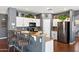 Contemporary kitchen with white cabinets, granite countertops, and a bar area with seating at 3679 S Cottonwood Ct, Chandler, AZ 85286