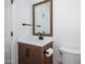 Modern bathroom featuring vanity with wood-grain cabinet, white countertop, toilet and black fixtures at 3755 E Broadway Rd # 21, Mesa, AZ 85206