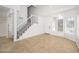 Bright foyer features staircase and tile floors at 3755 E Broadway Rd # 21, Mesa, AZ 85206