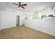A bright, open living space featuring neutral colors, tiled floors and modern ceiling fan at 3755 E Broadway Rd # 21, Mesa, AZ 85206