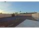 Backyard with gravel, a fire pit, and a fenced perimeter at 4132 E Sweetwater Ave, Phoenix, AZ 85032