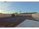 Large backyard area with decorative gravel, a fire pit, and block wall fencing at 4132 E Sweetwater Ave, Phoenix, AZ 85032
