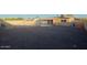 Large backyard with gravel, fenced pool, and home exterior at 4132 E Sweetwater Ave, Phoenix, AZ 85032