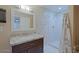 Bathroom featuring granite vanity top and tiled shower at 4132 E Sweetwater Ave, Phoenix, AZ 85032
