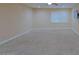 Cozy bedroom featuring plush carpeting, a ceiling fan, neutral walls and a tv at 4132 E Sweetwater Ave, Phoenix, AZ 85032