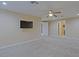 Bedroom with a ceiling fan and a TV mounted on the wall at 4132 E Sweetwater Ave, Phoenix, AZ 85032