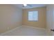An airy bedroom with a ceiling fan and a bright window at 4132 E Sweetwater Ave, Phoenix, AZ 85032