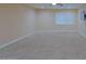 Spacious carpeted bedroom with a window at 4132 E Sweetwater Ave, Phoenix, AZ 85032