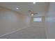 This bedroom features a fan and carpeted floor at 4132 E Sweetwater Ave, Phoenix, AZ 85032