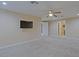 Spacious bedroom featuring a ceiling fan, plush carpeting, and ample natural light at 4132 E Sweetwater Ave, Phoenix, AZ 85032