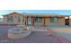 Charming home featuring a well-maintained front yard with a decorative water fountain and stone accents at 4132 E Sweetwater Ave, Phoenix, AZ 85032