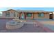 Single-story home featuring desert landscaping and a charming water fountain feature at 4132 E Sweetwater Ave, Phoenix, AZ 85032